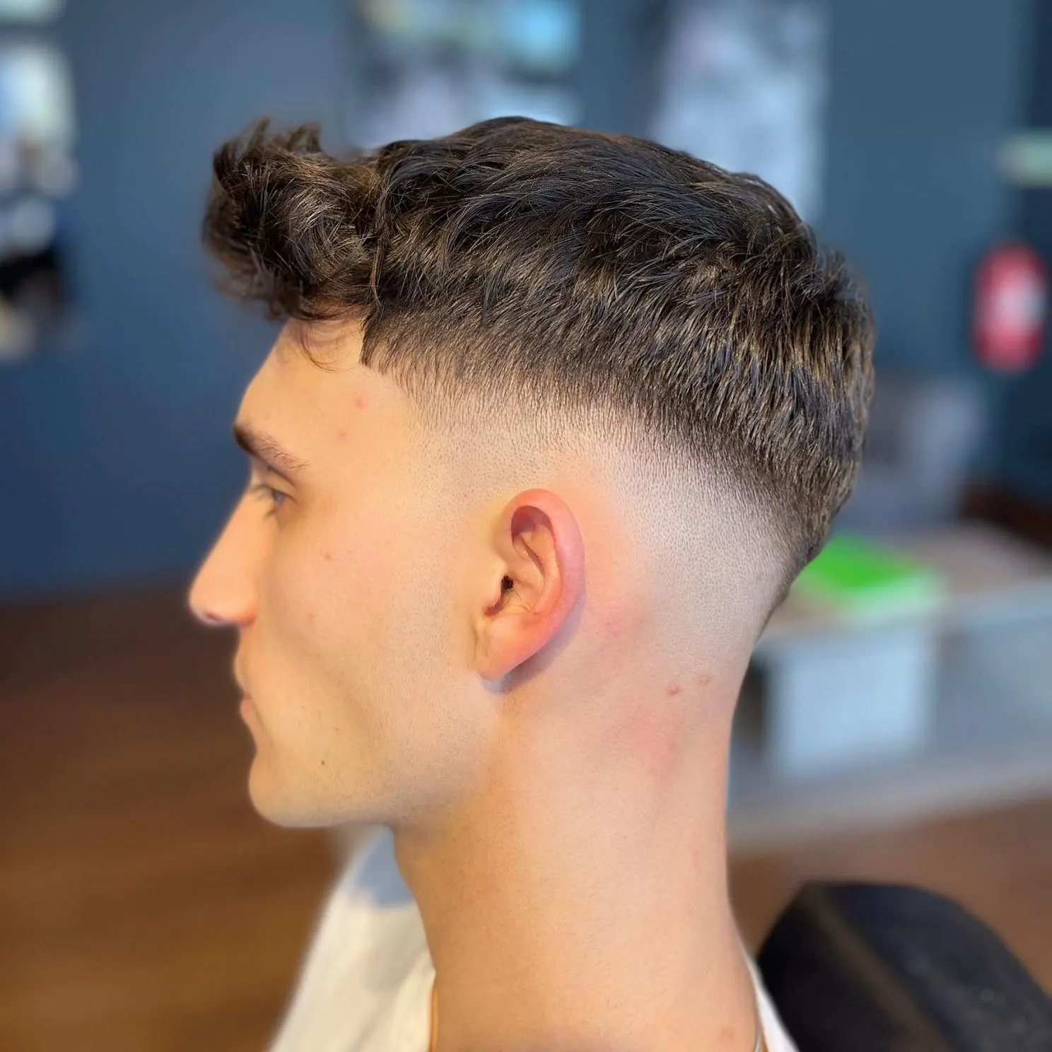 Perfil de cliente com low fade e franja texturizada